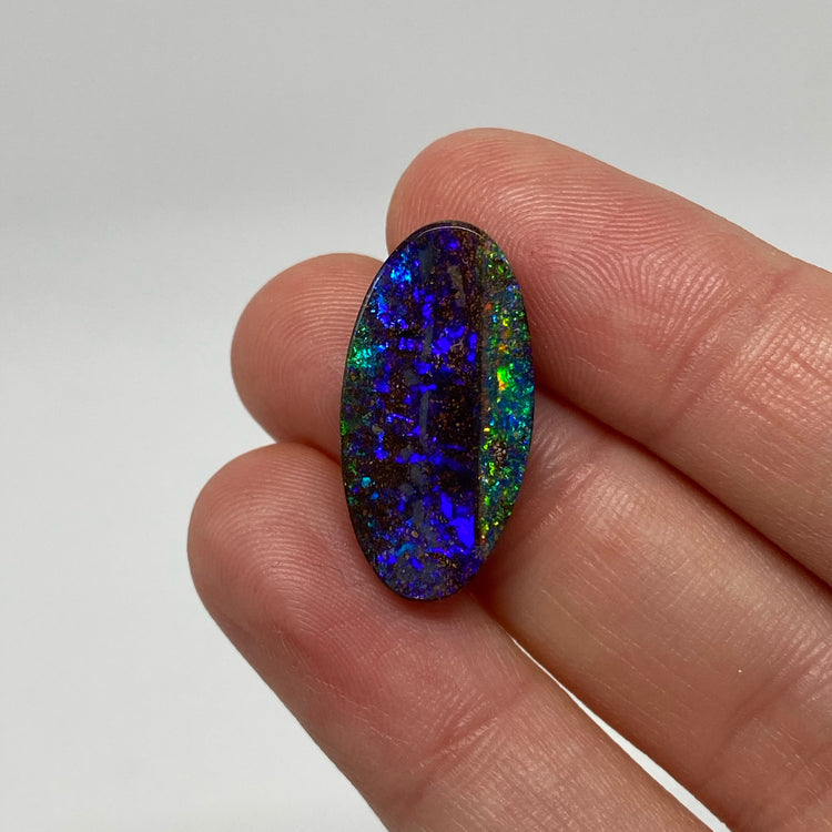 9.54 Ct purple oval boulder opal