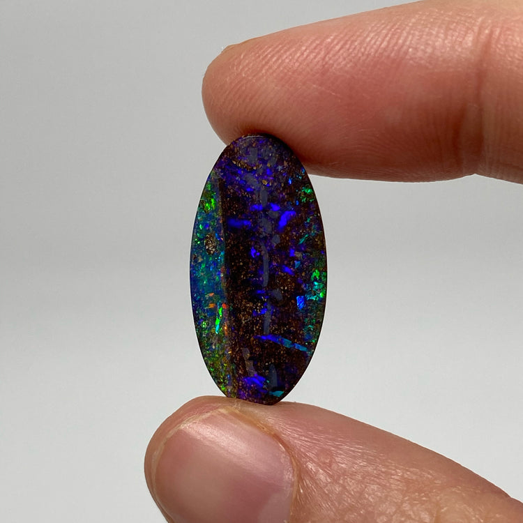 9.54 Ct purple oval boulder opal